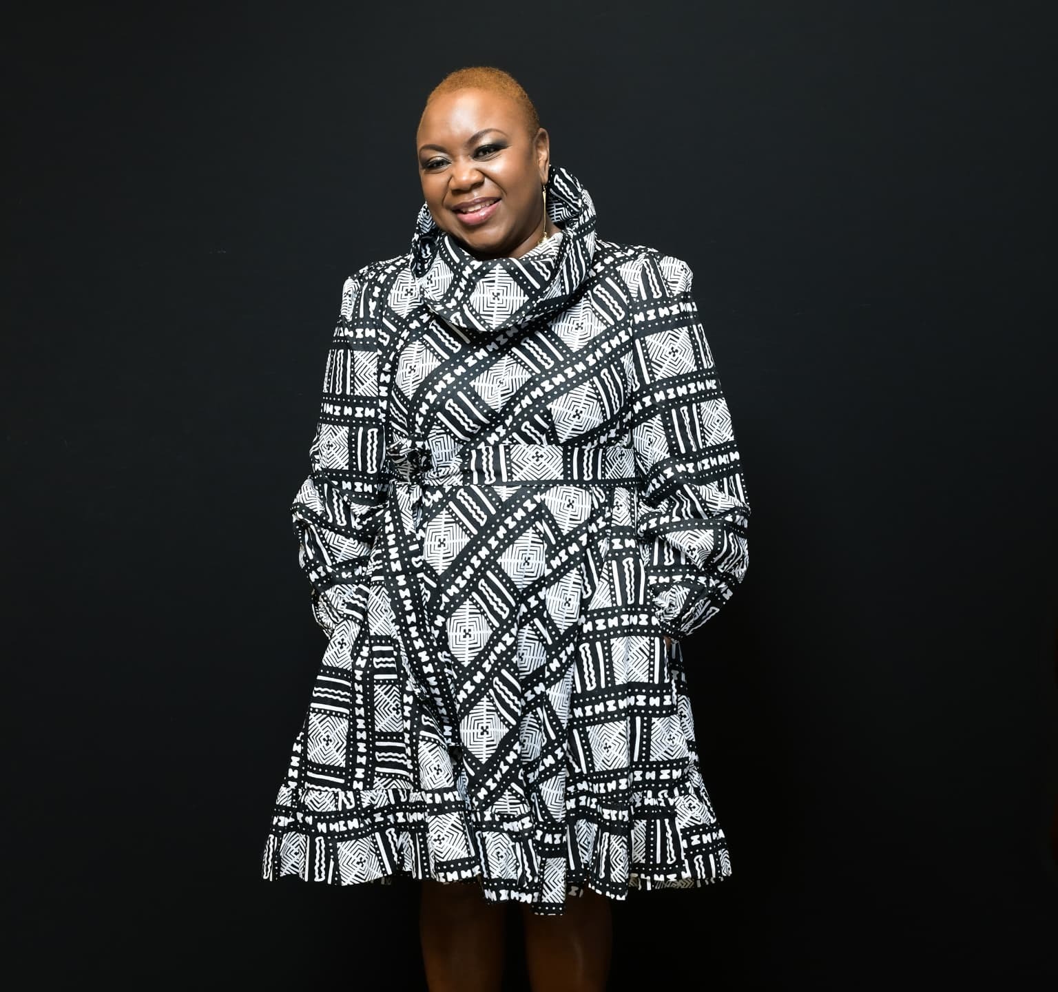 Portrait of Roselee Mathu in a patterned black and white dress