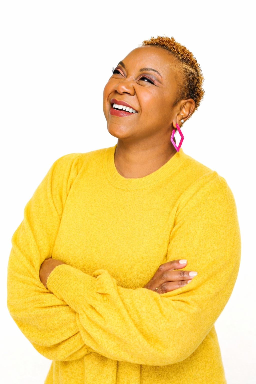 Roselee Mathu laughing in a yellow sweater
